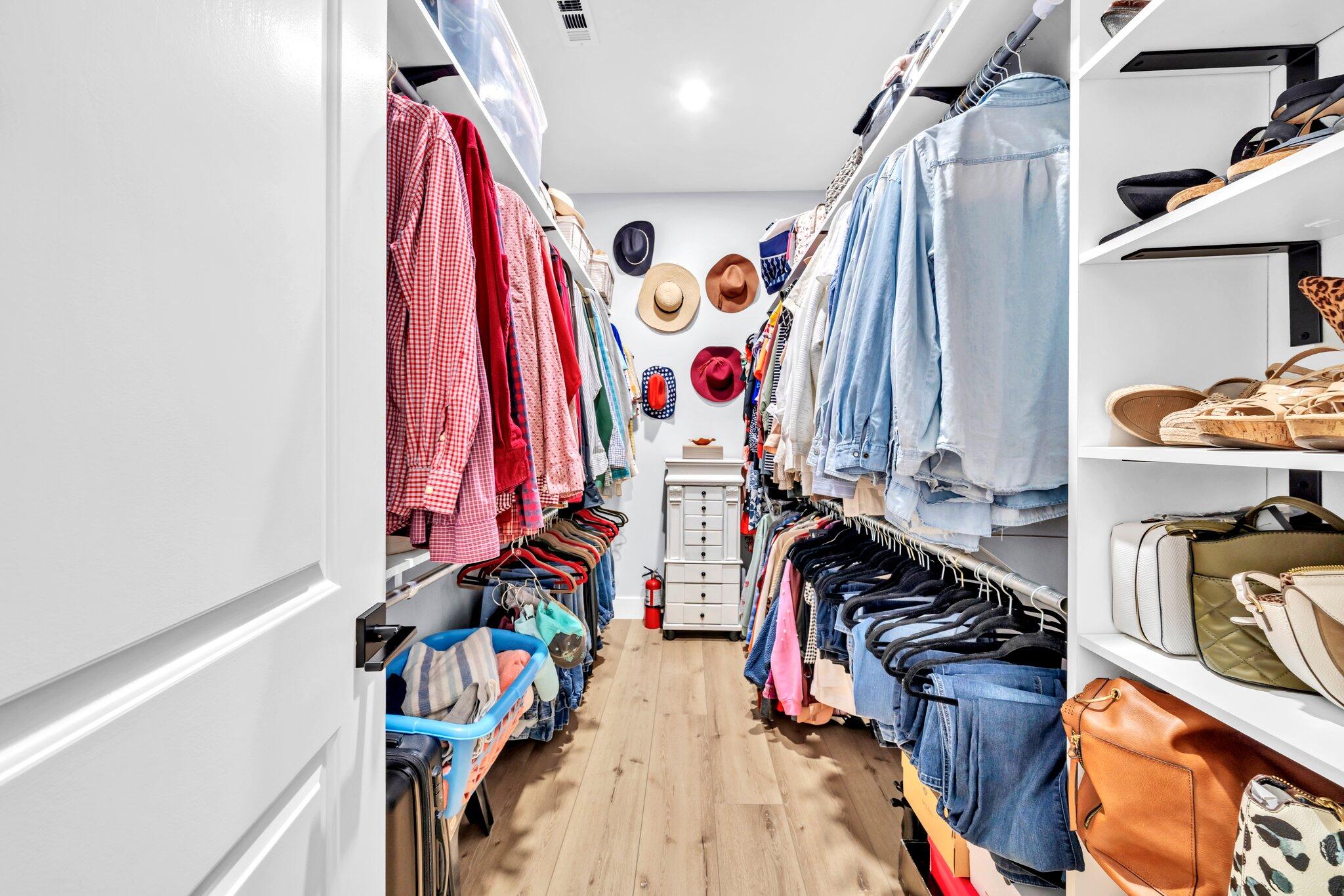 52 Lazy Bone St Point Vernon, FL 32462 - Photo 18 of 62 a view of walk in closet with clothes and shoes