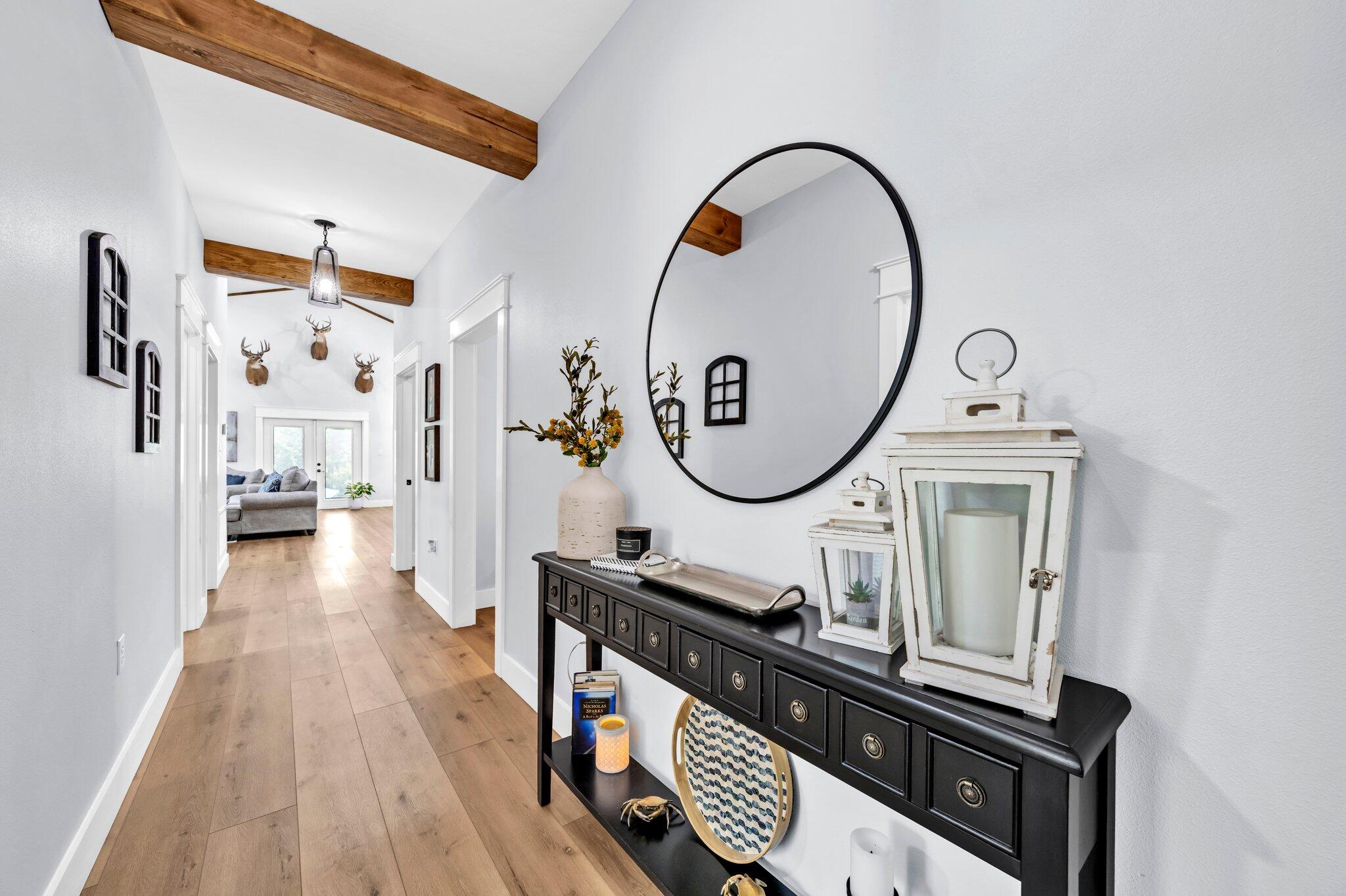 52 Lazy Bone St Point Vernon, FL 32462 - Photo 19 of 62 a living room with furniture a mirror and a wooden floor