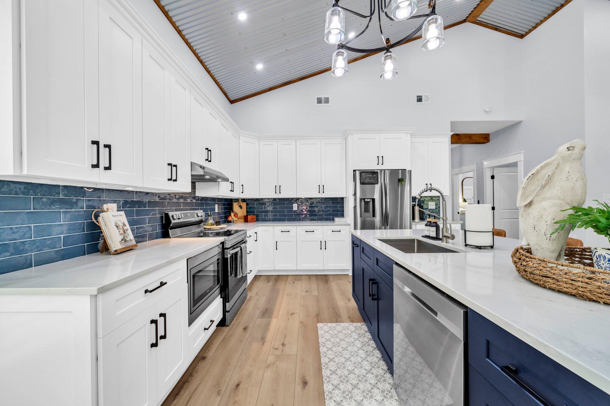 52 Lazy Bone St Point Vernon, FL 32462 - Photo 28 of 62 a large white kitchen with stainless steel appliances granite countertop lots of counter top space