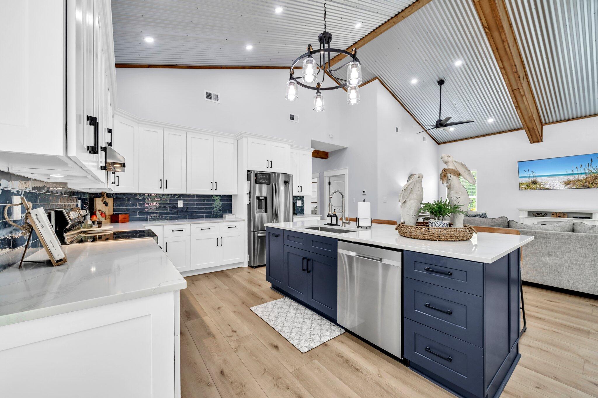 52 Lazy Bone St Point Vernon, FL 32462 - Photo 29 of 62 a kitchen with a sink stainless steel appliances and cabinets