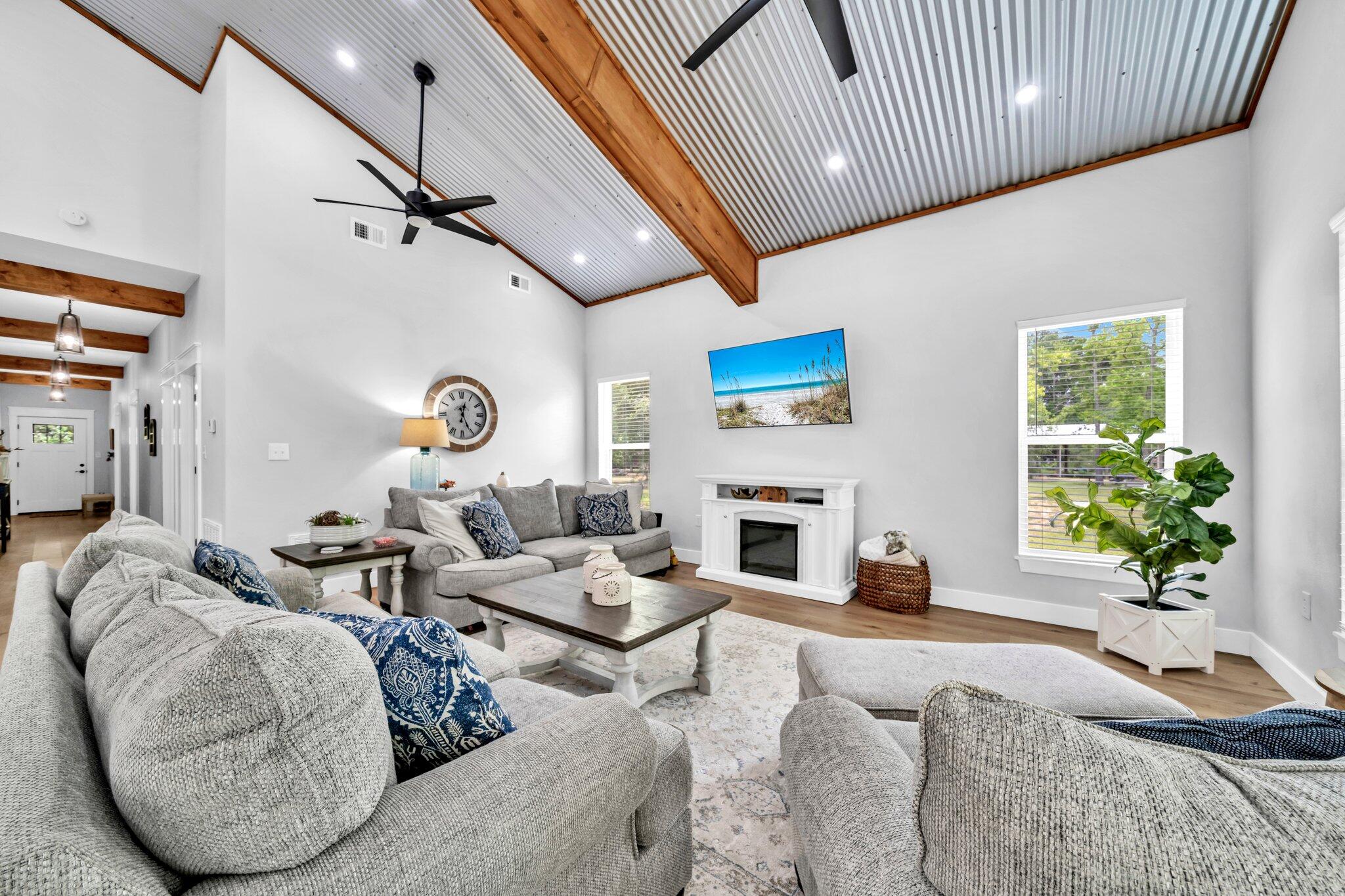 52 Lazy Bone St Point Vernon, FL 32462 - Photo 33 of 62 a living room with furniture a fireplace and a window