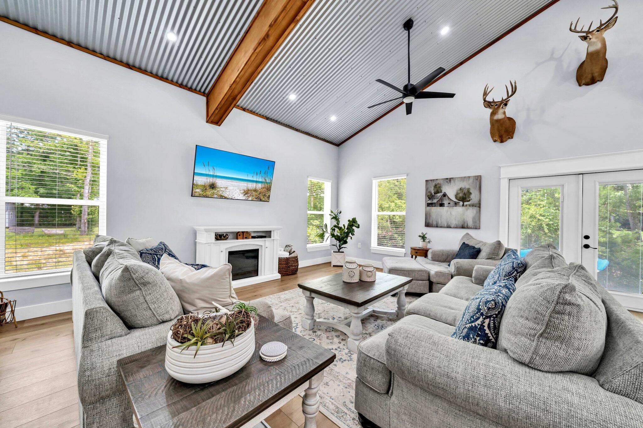 52 Lazy Bone St Point Vernon, FL 32462 - Photo 34 of 62 a living room with furniture kitchen view and a large window