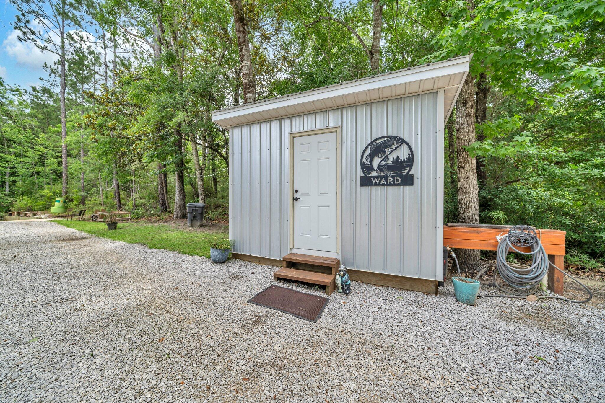 52 Lazy Bone St Point Vernon, FL 32462 - Photo 39 of 62 a backyard of a house with barbeque oven