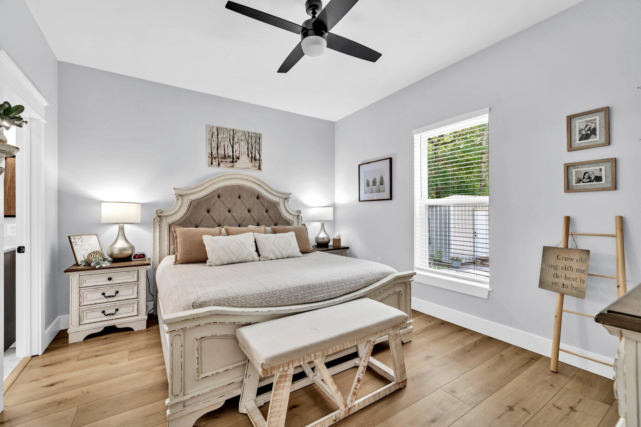 52 Lazy Bone St Point Vernon, FL 32462 - Photo 6 of 62 a bedroom with a bed and wooden floor