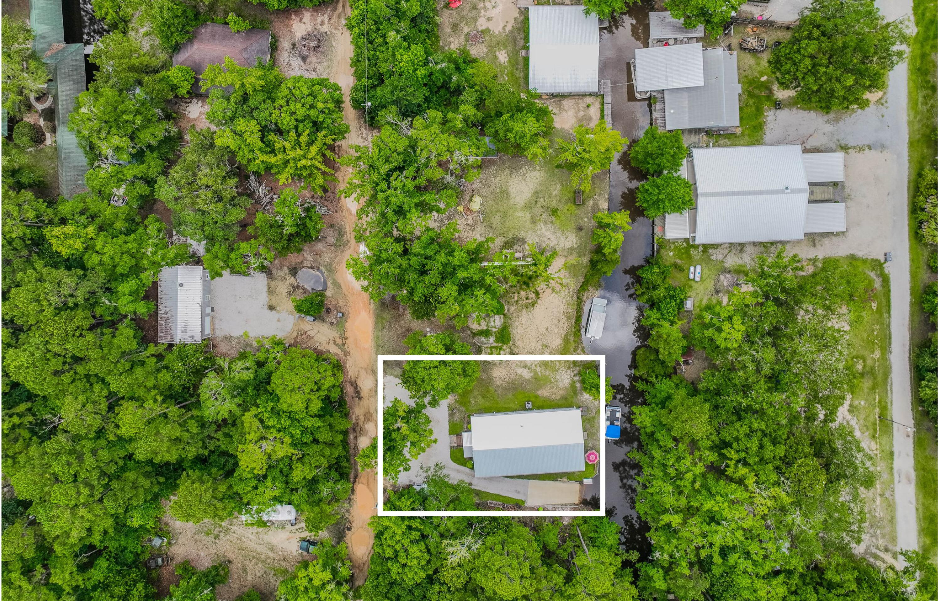 52 Lazy Bone St Point Vernon, FL 32462 - Photo 7 of 62 an aerial view of a house with a garden