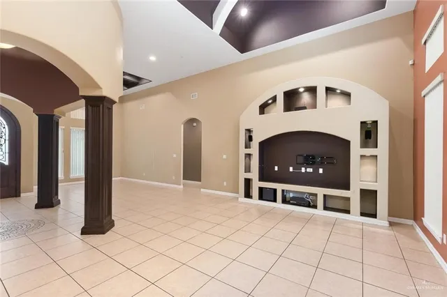 a front view of a house with a fireplace and chandelier