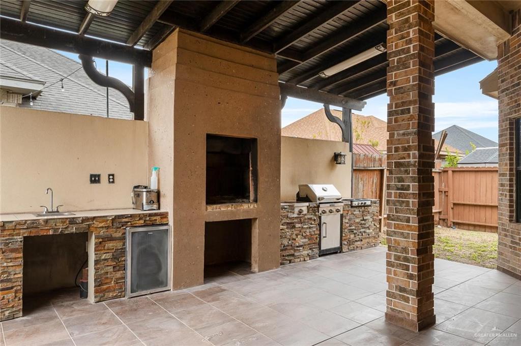 1910 West 41st Street Mission, TX 78573 - Photo 6 of 15 a view of a kitchen with furniture and a kitchen