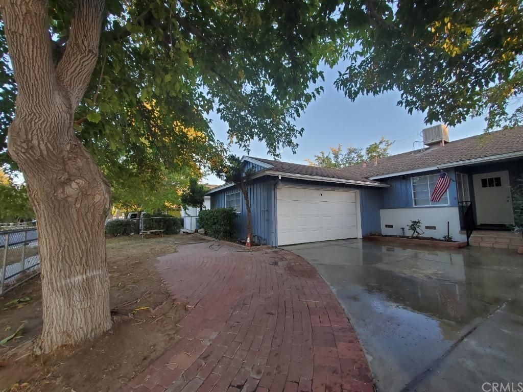 a view of a house with a tree