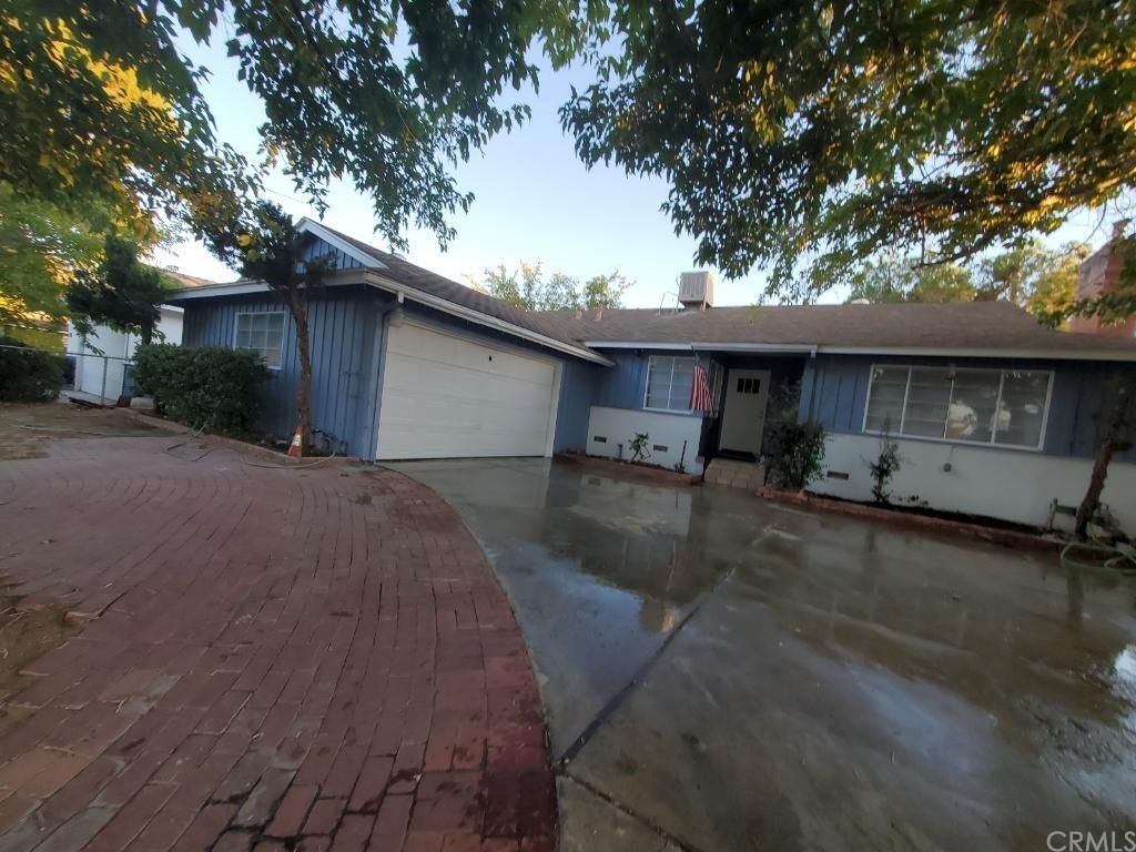 910 West Ave J8 Lancaster, CA 93534 - Photo 2 of 24 a backyard of a house with table and chairs