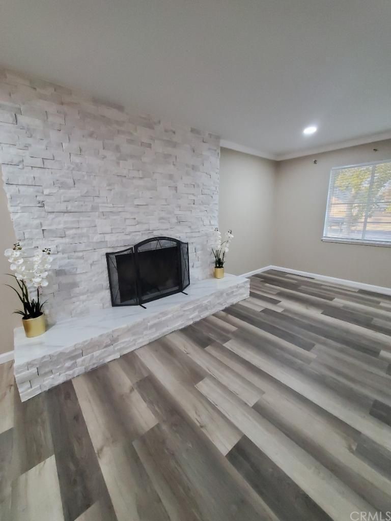 910 West Ave J8 Lancaster, CA 93534 - Photo 14 of 24 a bedroom with a bed and a fireplace