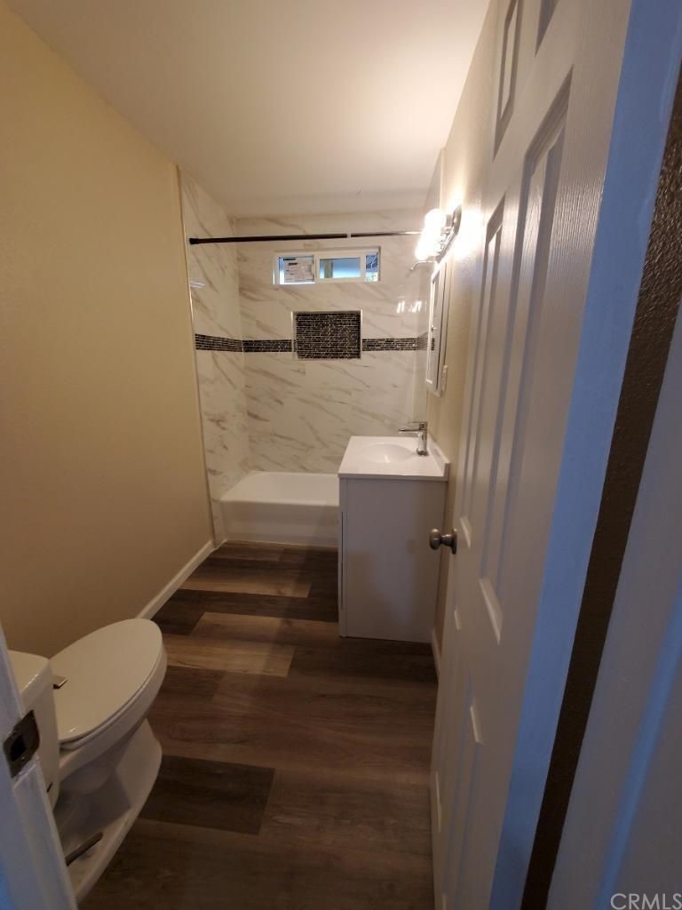 910 West Ave J8 Lancaster, CA 93534 - Photo 20 of 24 a bathroom with a toilet and a sink