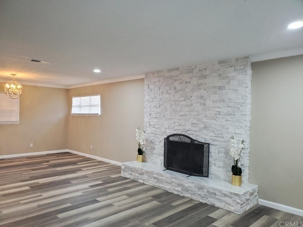 910 West Ave J8 Lancaster, CA 93534 - Photo 22 of 24 a living room with a fireplace and a table