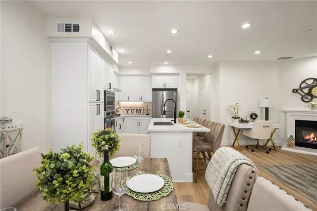 a kitchen with a sink stainless steel appliances and cabinets