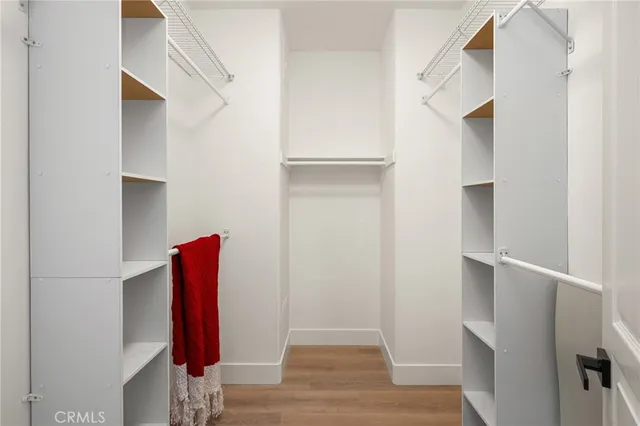 a bedroom with a bed and a night stand