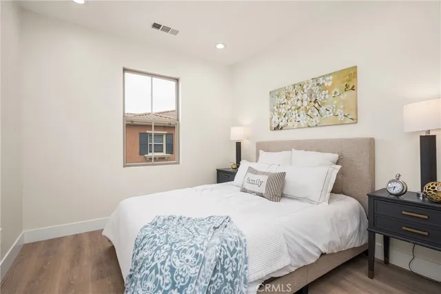 a bathroom with a sink vanity granite and toilet