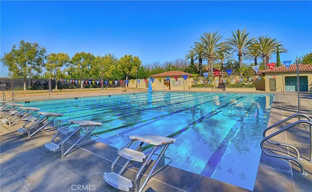 a view of a backyard with plants and a patio