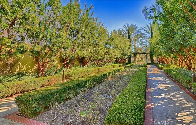 a view of a pathway of a building next to a yard