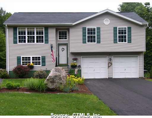 33 Picabo Street Killingly, CT 06239 - Photo 1 of 1 a front view of a house with a yard and garage