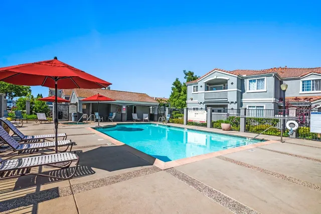 a front view of house with yard and outdoor seating