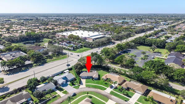 an aerial view of residential houses with outdoor space