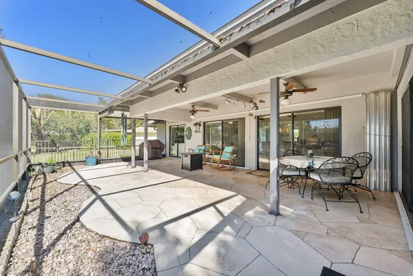 a view of a kitchen with refrigerator and cabinets