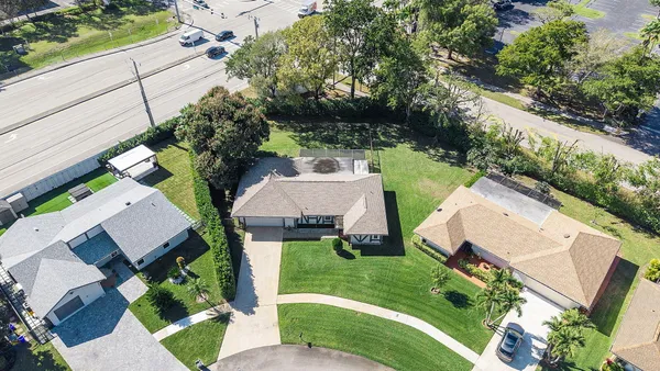 an aerial view of a house with outdoor space
