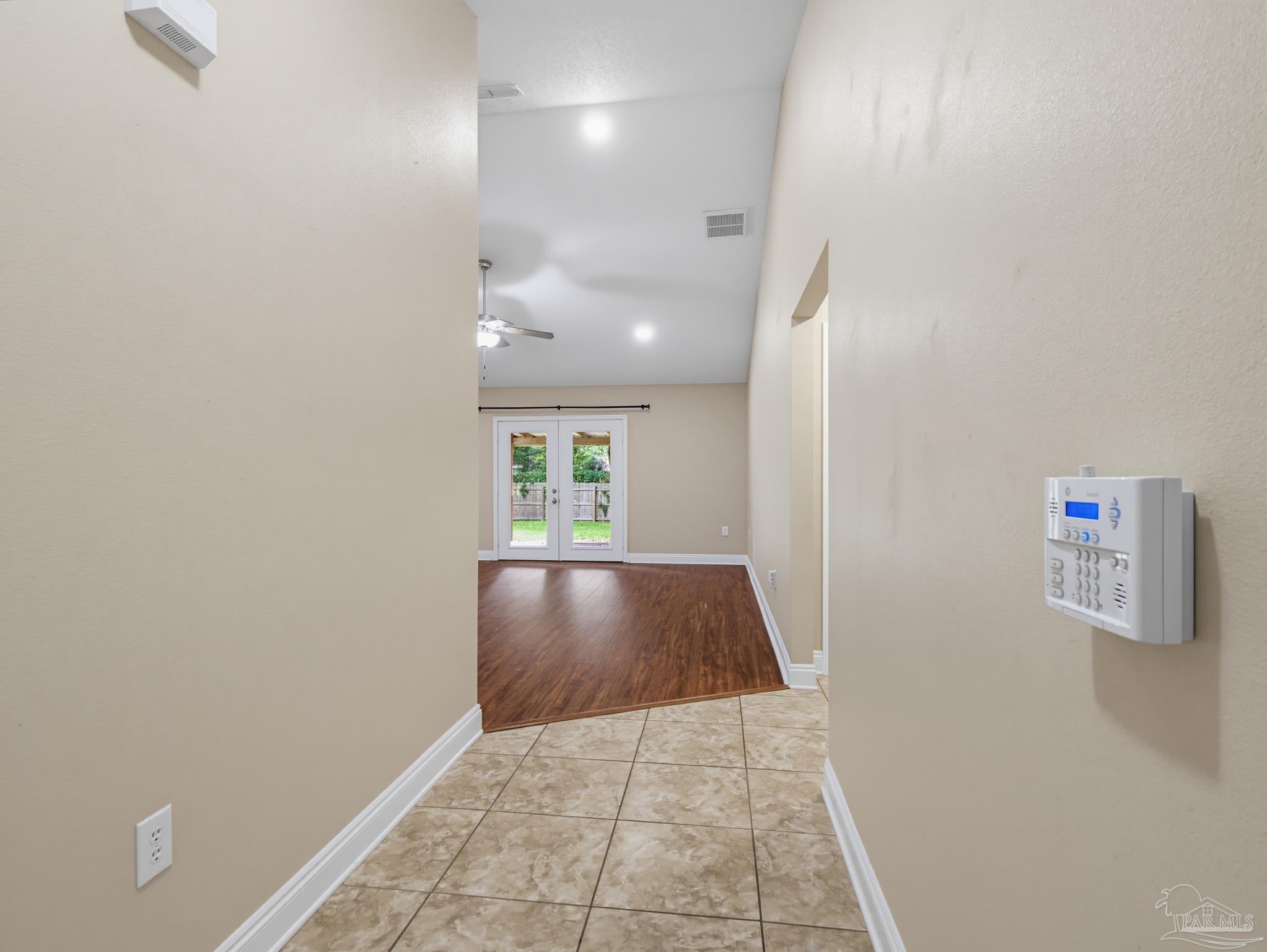 5567 Jones Street Milton, FL 32570 - Photo 6 of 48 a view of hallway with a window and a rug