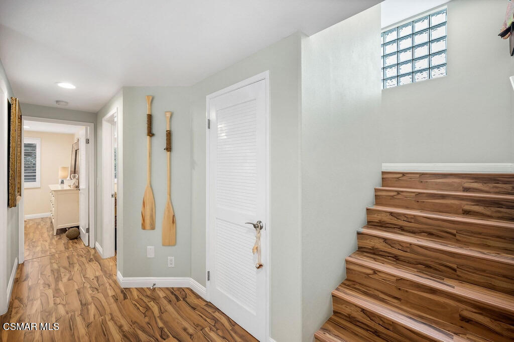 3237 Playa Court Oxnard, CA 93035 - Photo 9 of 48 a view of a hallway with wooden floor and staircase
