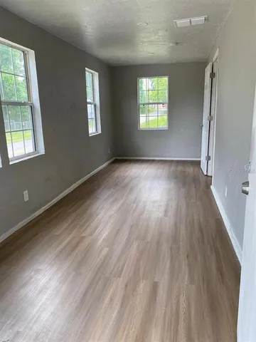 a view of an empty room and window