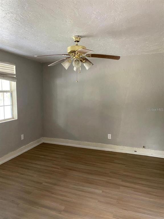 504 Southwest Fort King Street Ocala, FL 34471 - Photo 8 of 13 a view of room with window and ceiling fan