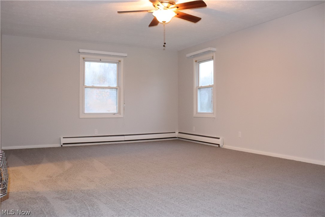 14302 Main Market Road Hiram, OH 44234 - Photo 8 of 20 New paint and carpet throughout, including this living room