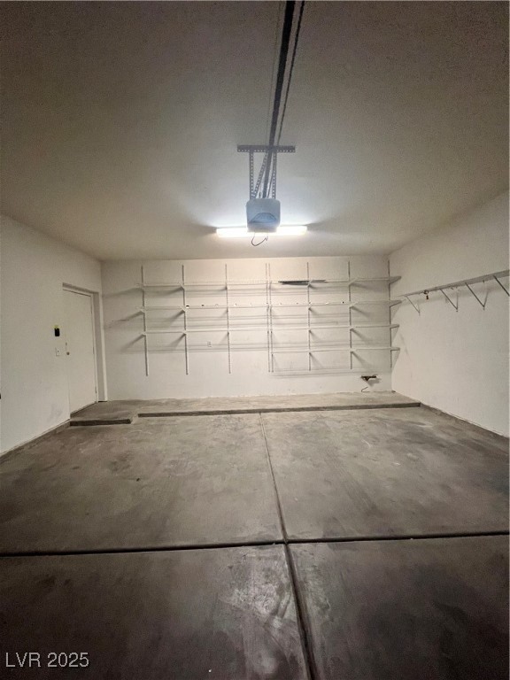 2152 Quarry Ridge Street, Unit 103 Las Vegas, NV 89117 - Photo 12 of 43 Garage with a garage door opener