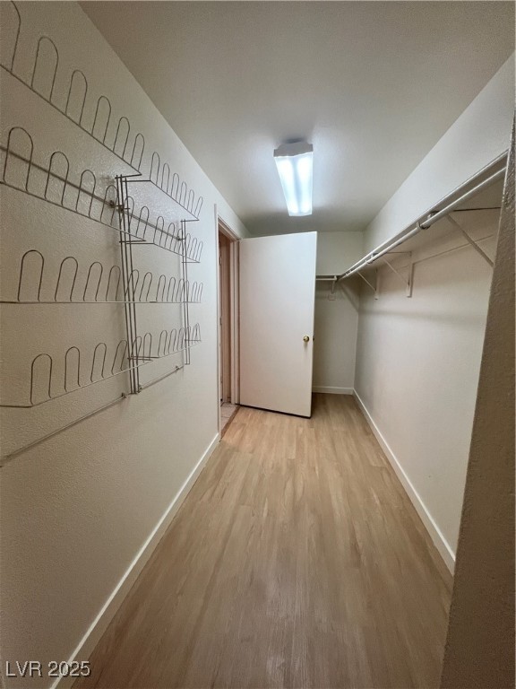 2152 Quarry Ridge Street, Unit 103 Las Vegas, NV 89117 - Photo 18 of 43 Spacious closet featuring light wood-style flooring