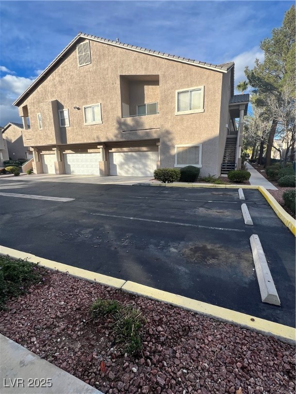 2152 Quarry Ridge Street, Unit 103 Las Vegas, NV 89117 - Photo 2 of 43 View of parking with stairs