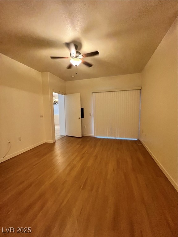 2152 Quarry Ridge Street, Unit 103 Las Vegas, NV 89117 - Photo 22 of 43 Unfurnished bedroom with wood finished floors, a textured ceiling, a ceiling fan, and a closet