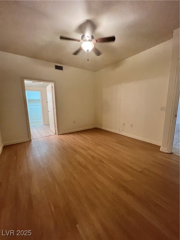 2152 Quarry Ridge Street, Unit 103 Las Vegas, NV 89117 - Photo 23 of 43 Spare room featuring light wood finished floors, a ceiling fan, and a textured ceiling