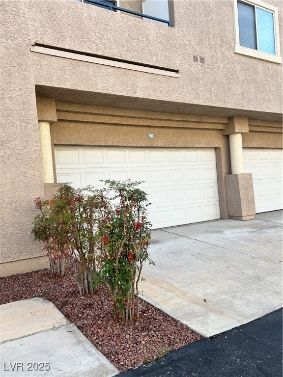 2152 Quarry Ridge Street, Unit 103 Las Vegas, NV 89117 - Photo 3 of 43 Garage with driveway