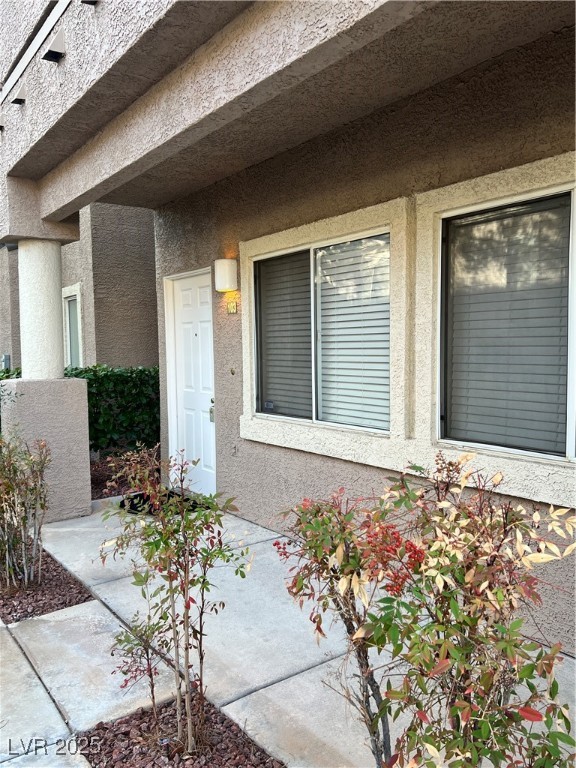 2152 Quarry Ridge Street, Unit 103 Las Vegas, NV 89117 - Photo 4 of 43 Doorway to property with stucco siding
