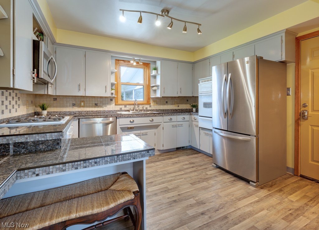 3176 Brenner Road Barberton, OH 44203 - Photo 9 of 24 Spacious kitchen with counter seating. All kitchen appliances stay with the home.