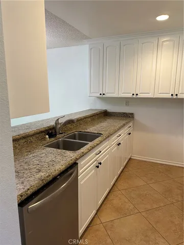 a kitchen that has a sink and a stove