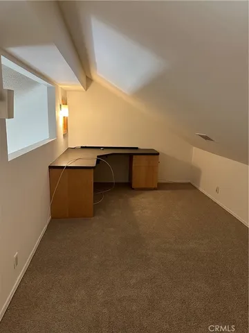 a view of a closet with wooden floor