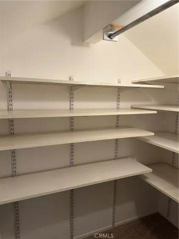 a view of a room with wooden floor and staircase