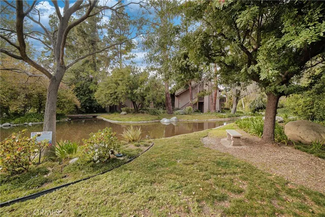 a view of house with outdoor space and garden