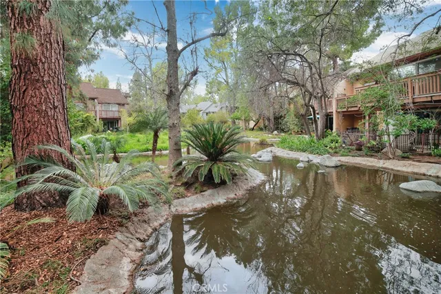 a view of a lake with a yard