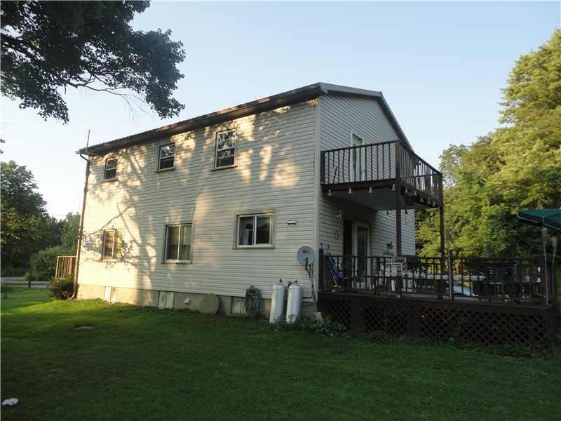 402 Boyers Road Harrisville, PA 16038 - Photo 3 of 5 Exterior Back. back and side of home showing the large lower deck and a smaller deck off the 2nd floor