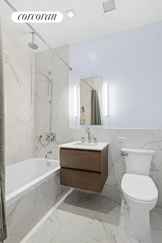 a bathroom with a sink a toilet and a bathtub