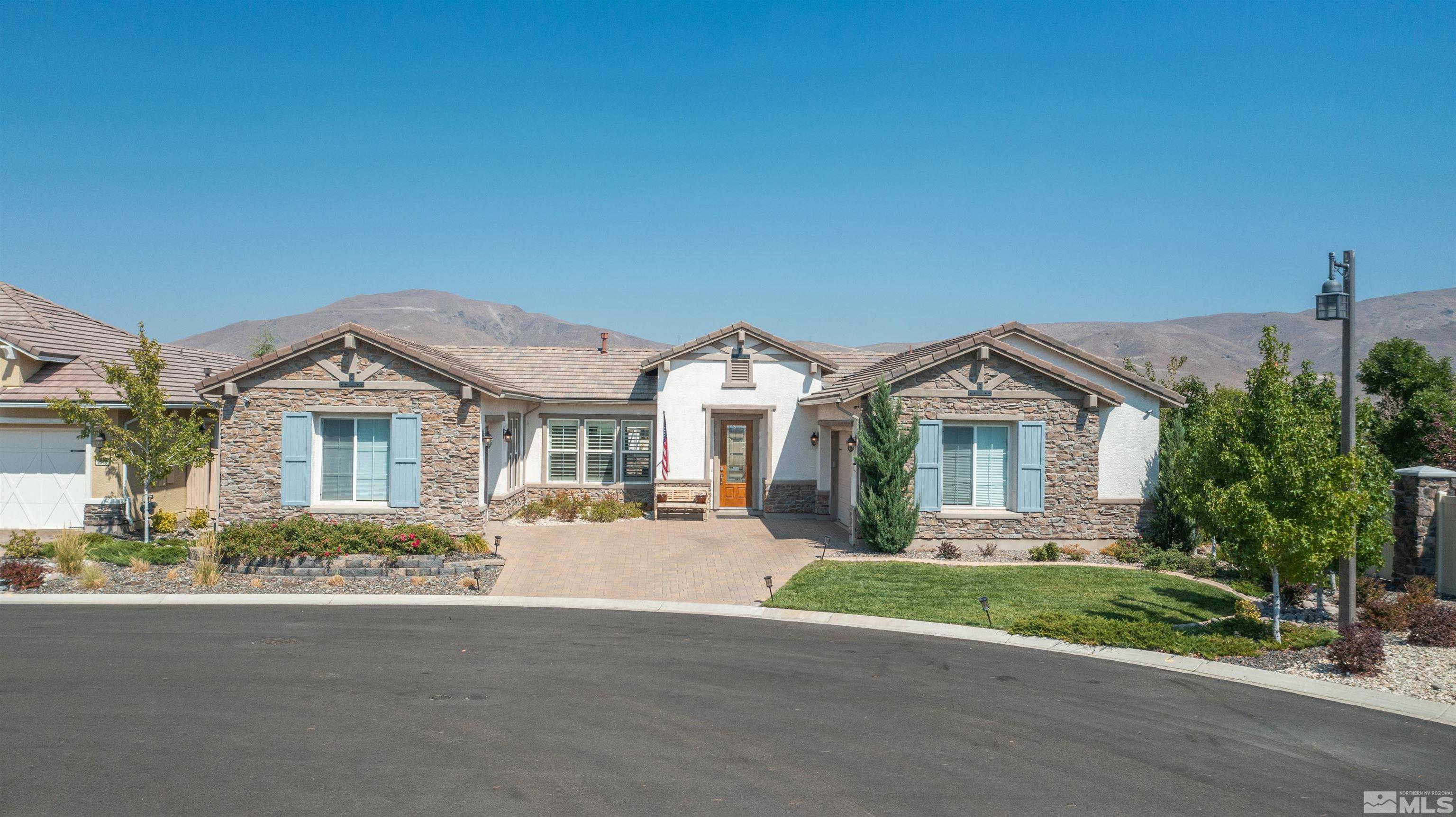 9990 Hafflinger Court Reno, NV 89521 - Photo 1 of 40 a front view of a house with a yard and garage