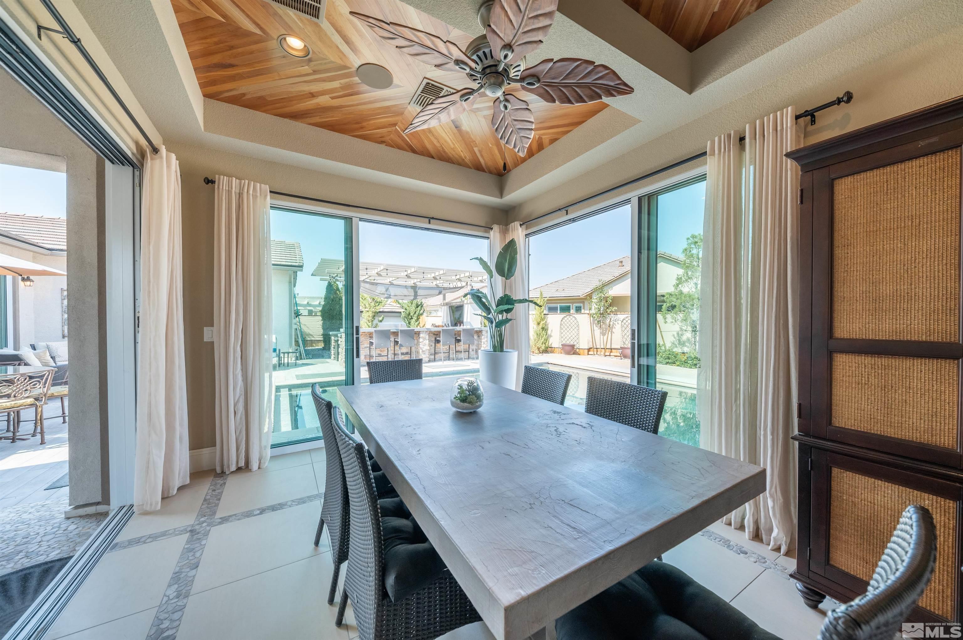 9990 Hafflinger Court Reno, NV 89521 - Photo 15 of 40 a view of a dining room with furniture window and outside view