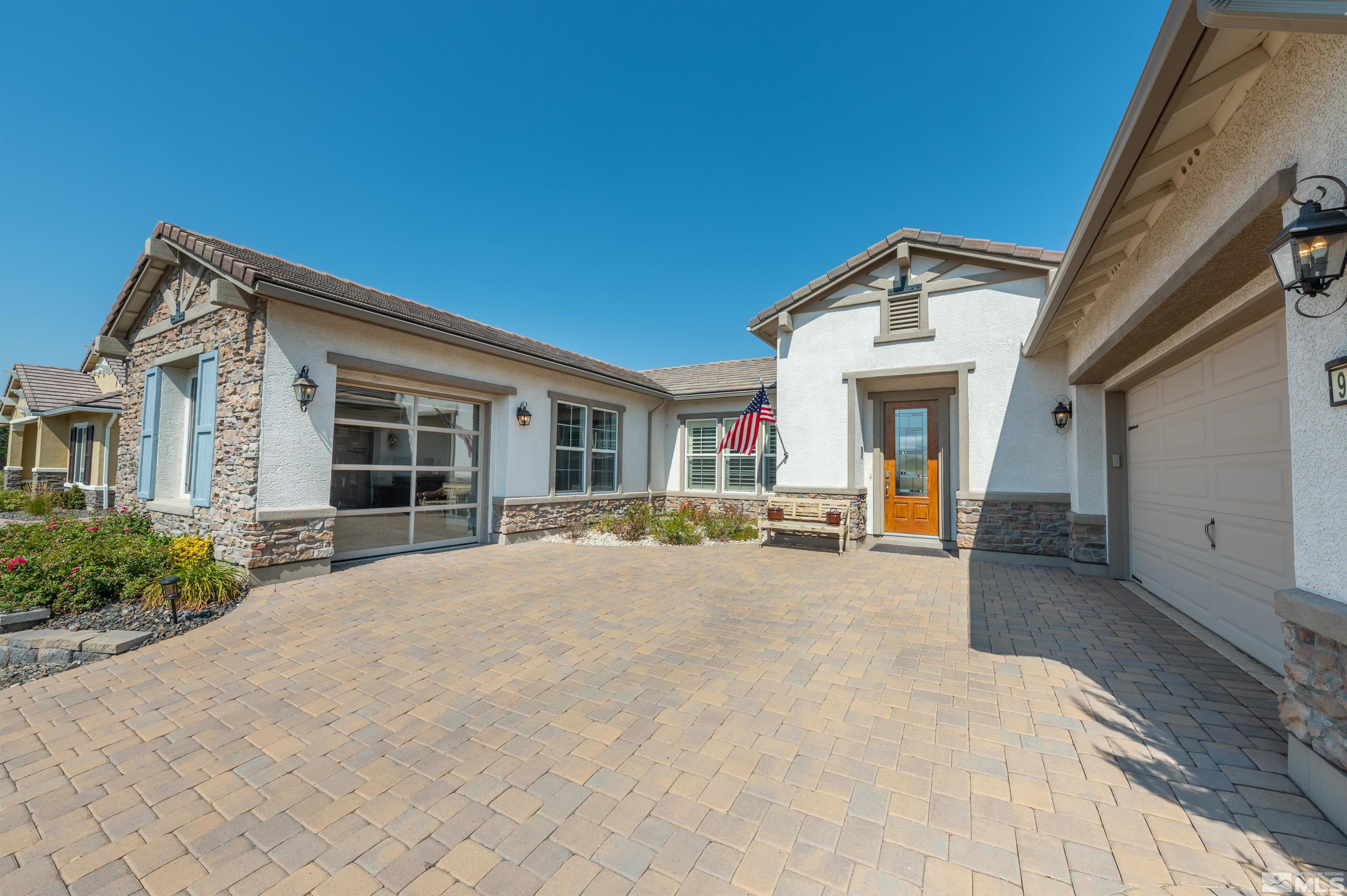 9990 Hafflinger Court Reno, NV 89521 - Photo 35 of 40 a view of a house with backyard and porch