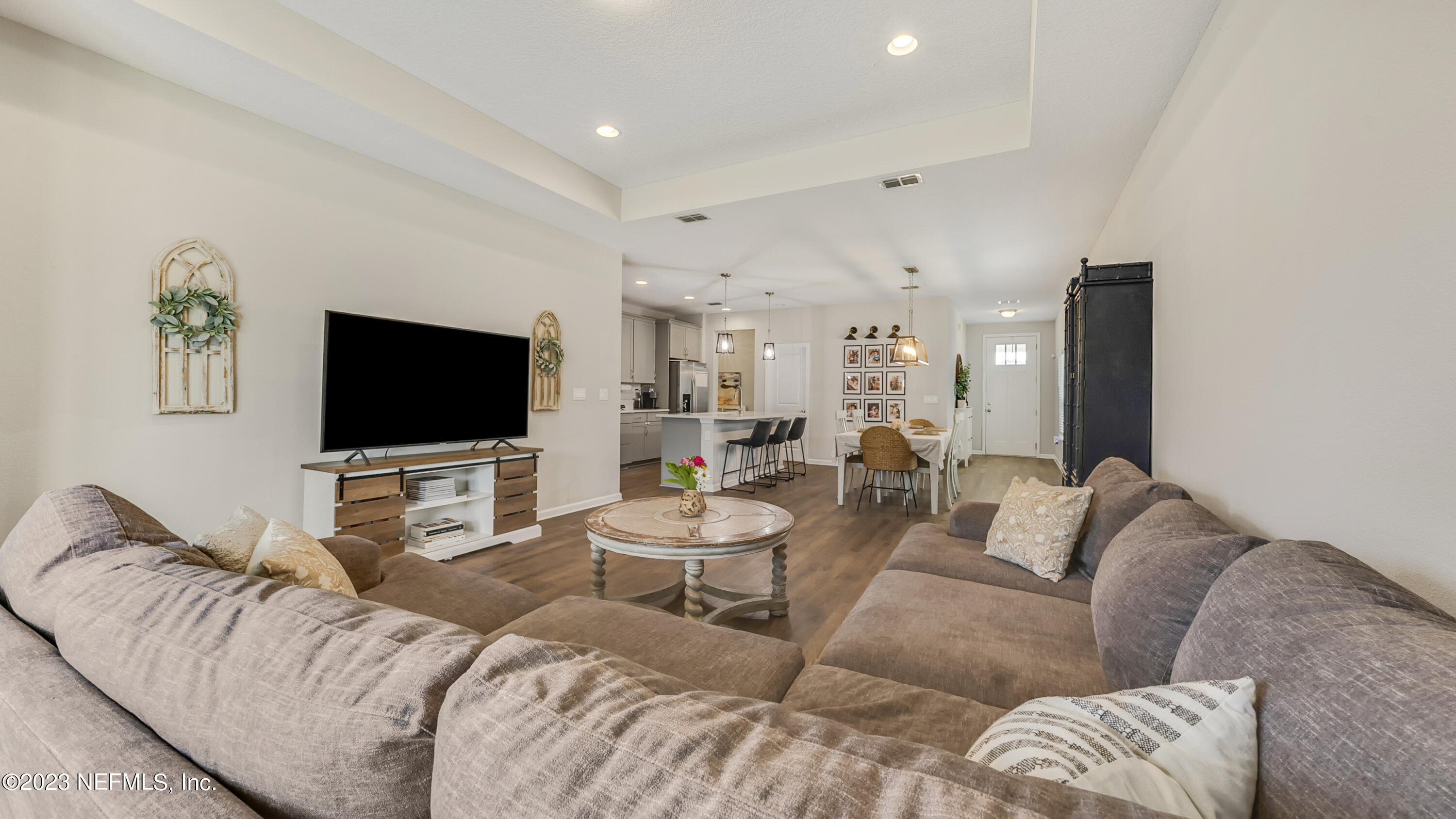 321 Beale Avenue St. Augustine, FL 32092 - Photo 11 of 35 a living room with furniture and a flat screen tv